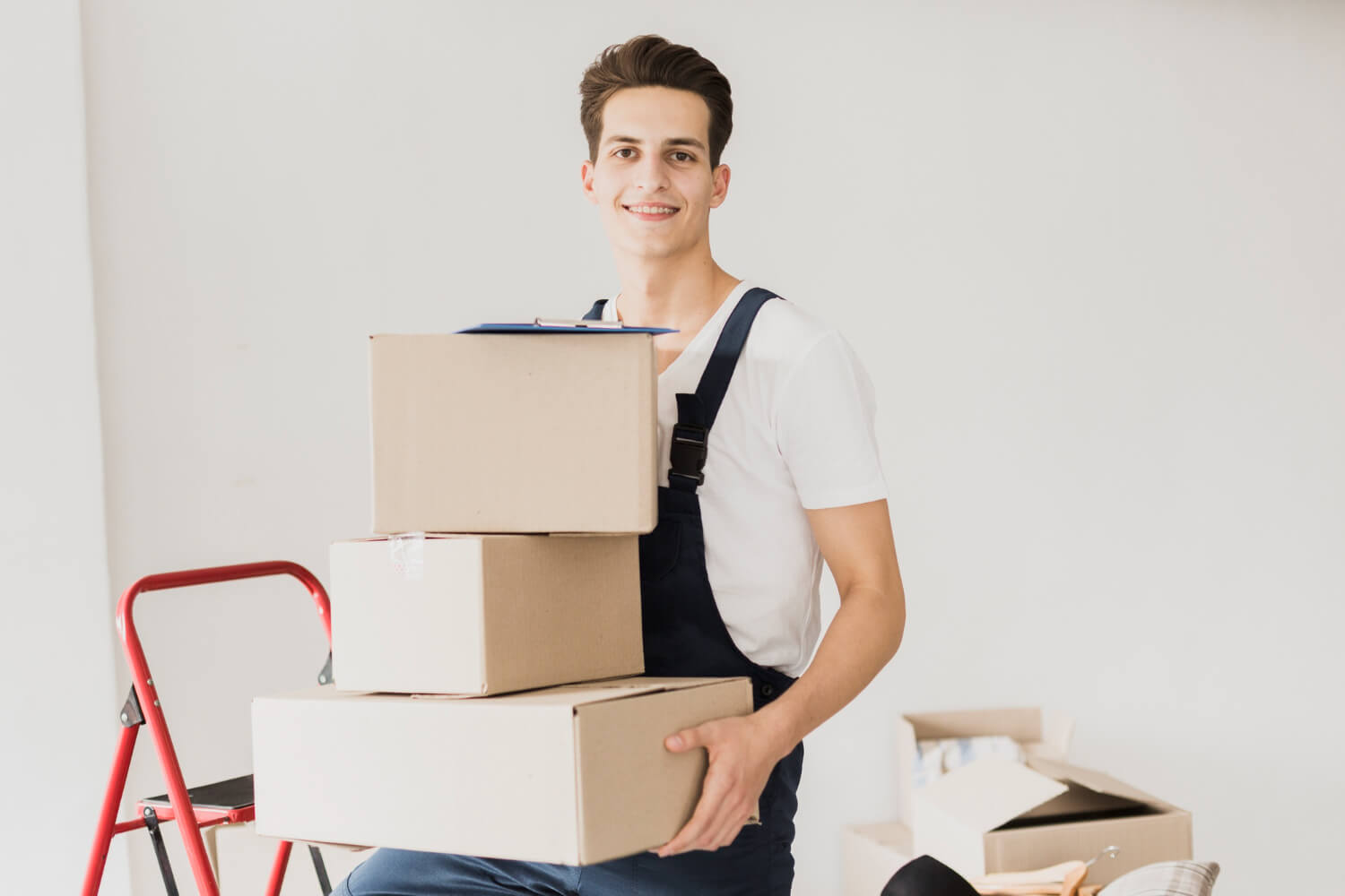 smiley mover holding carton moving boxes for relocation