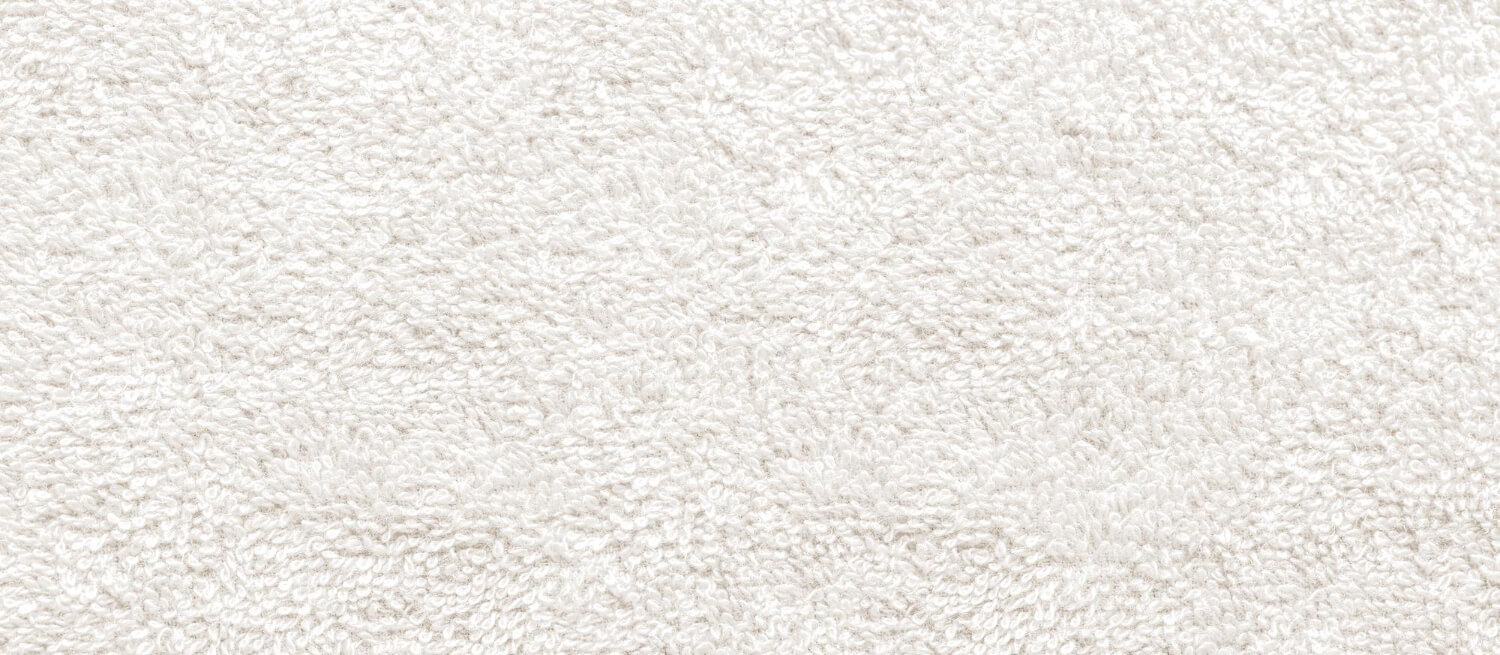 close up top view of white carpet