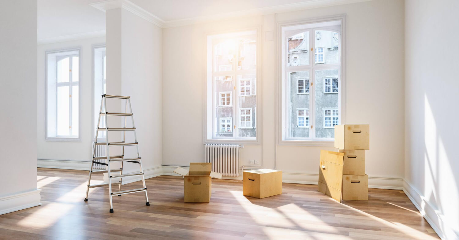 empty bright office with staffed moving boxes