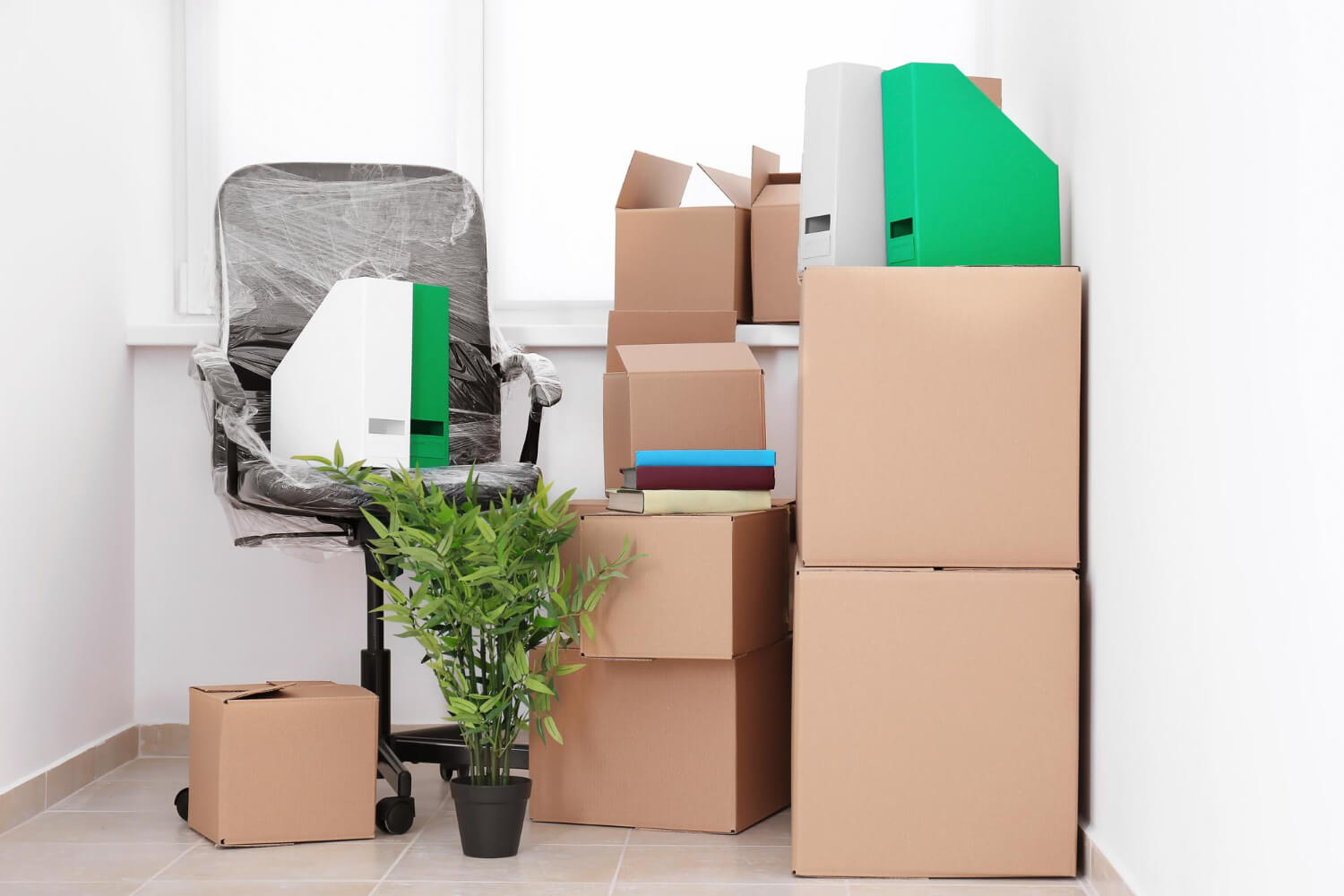 front view of office furniture chair wrapped and moving boxes for moving out